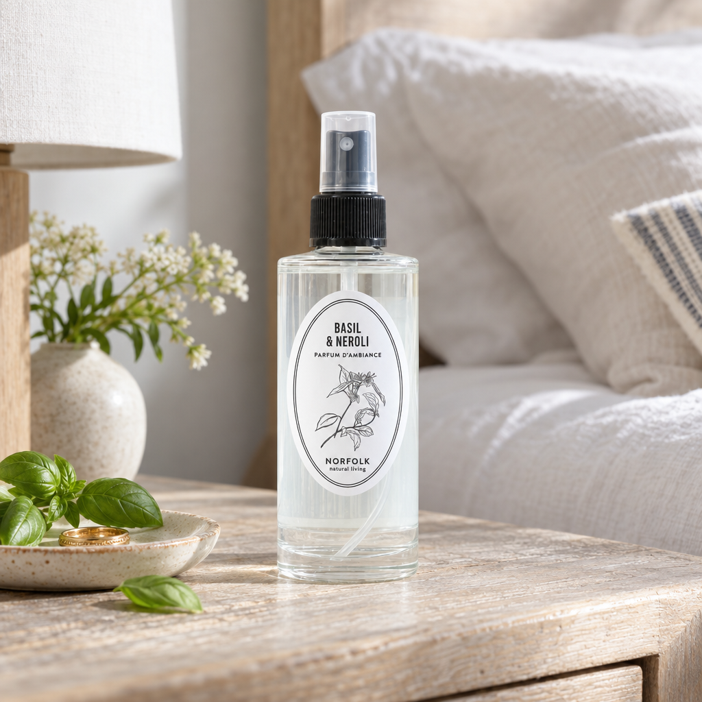 Norfolk Natural Living Basil and Neroli mood mist on a bedside table