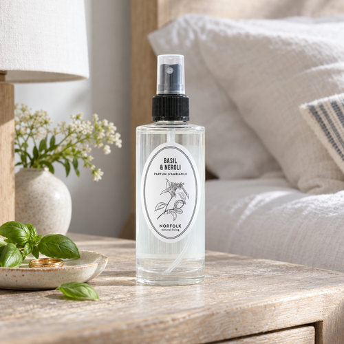 Norfolk Natural Living Basil and Neroli mood mist on a bedside table