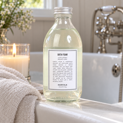 Norfolk Natural Living Deepest Sleep Bath Foam on the edge of a bath