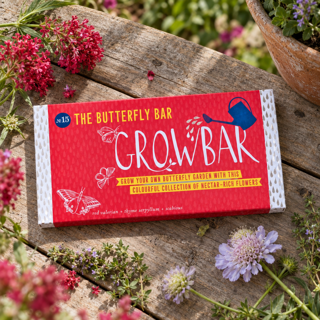 The Butterfly Bar Growbar No.15 on a garden table with valerian and scabious