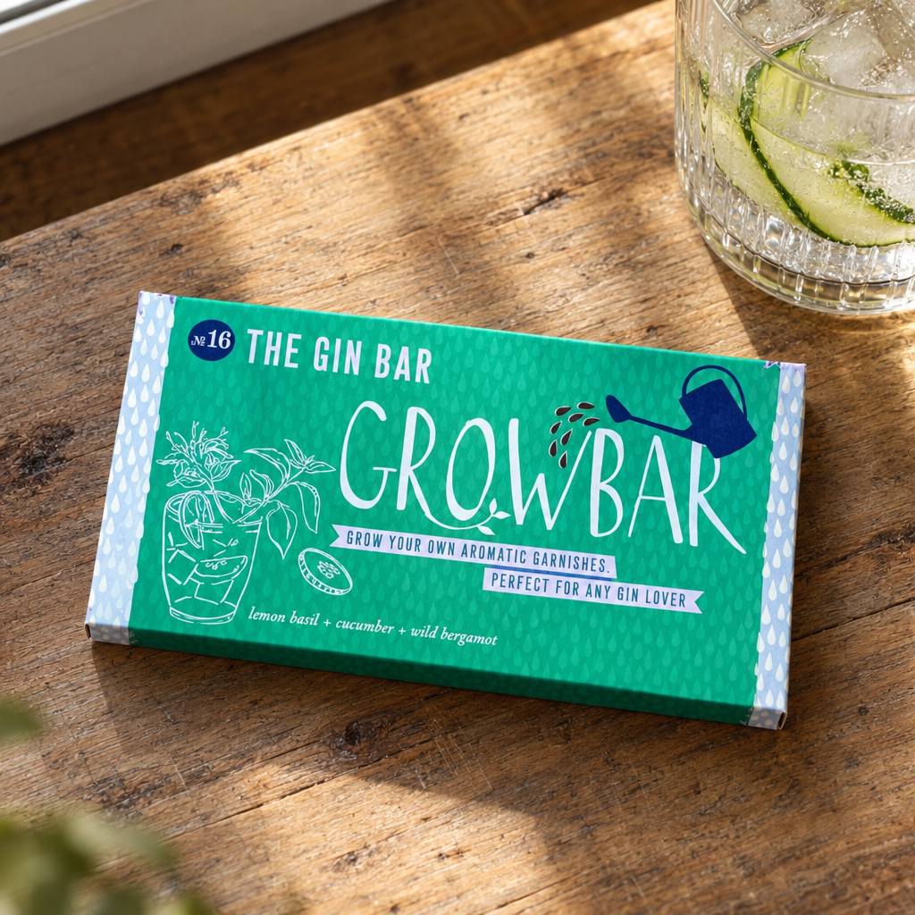 The Gin Bar Growbar No.16 seed kit on an oak kitchen counter beside a gin and tonic