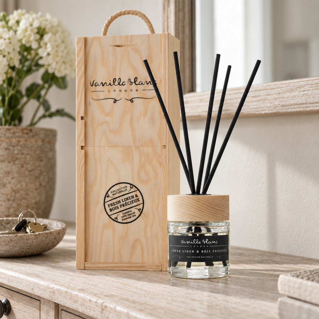 Vanilla Blanc Fresh Linen and Bois Precieux reed diffuser with its wooden box